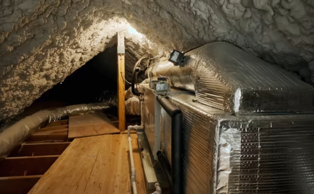 Attic insulation under a pitched roof with a wooden frame