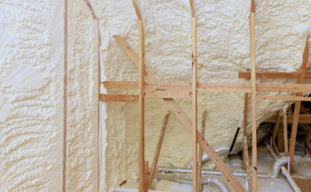 New house attic with spray foam thermal insulation system.